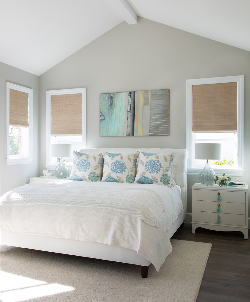 Photo of a beach style bedroom in Denver with grey walls, dark hardwood floors and brown floor.