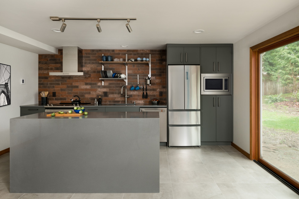 Example of a small trendy single-wall porcelain tile and gray floor open concept kitchen design in Seattle with an undermount sink, flat-panel cabinets, gray cabinets, quartz countertops, brown backsplash, porcelain backsplash, stainless steel appliances, an island and gray countertops