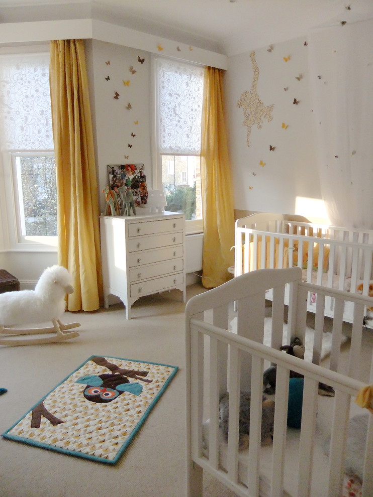 Design ideas for a large eclectic nursery for girls in London with carpet.