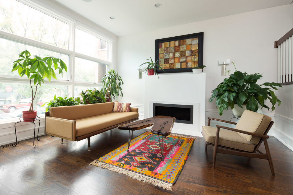 Inspiration for a transitional dark wood floor living room remodel in Chicago with white walls, a ribbon fireplace and no tv