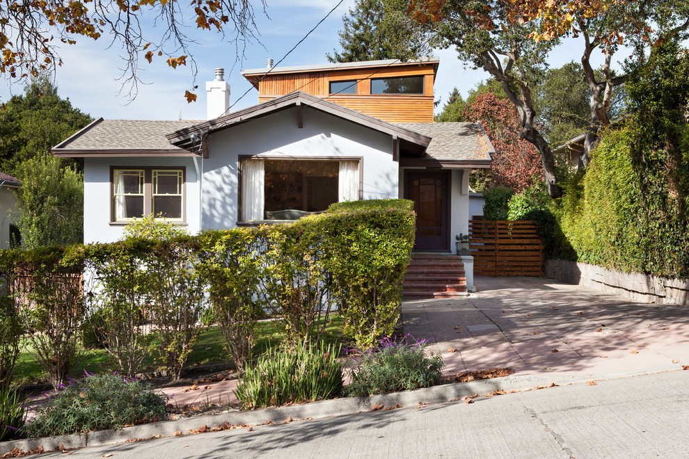 Inspiration for a mid-sized eclectic two-storey grey exterior in San Francisco with wood siding and a shed roof.
