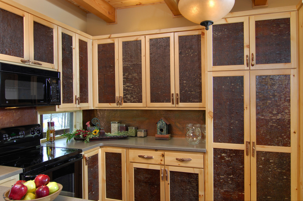 Inspiration for a mid-sized rustic u-shaped eat-in kitchen remodel with flat-panel cabinets, distressed cabinets, laminate countertops, stainless steel appliances and no island