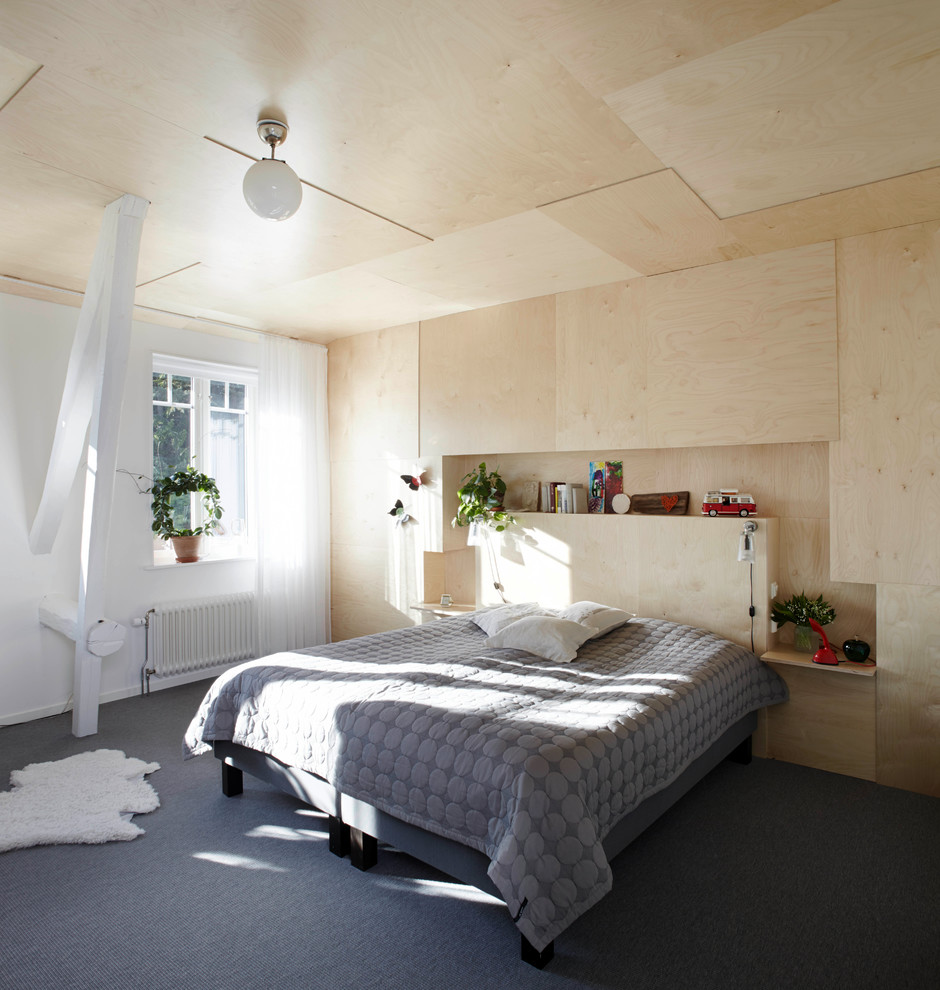 Mid-sized scandinavian master bedroom in Bremen with carpet, no fireplace and beige walls.