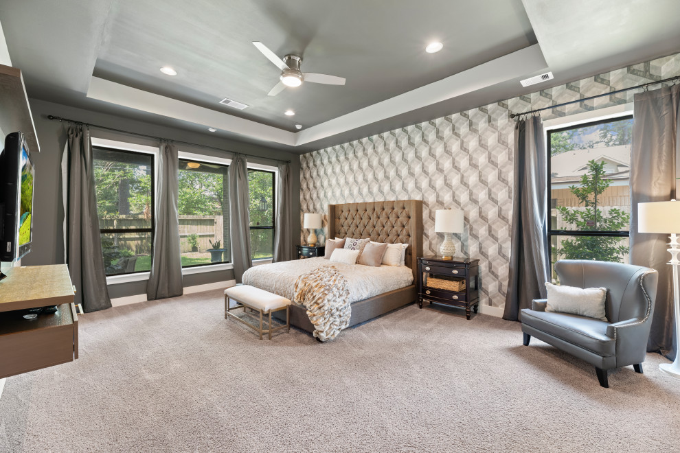 This is an example of an expansive contemporary master bedroom in Houston with multi-coloured walls, carpet, beige floor and recessed.