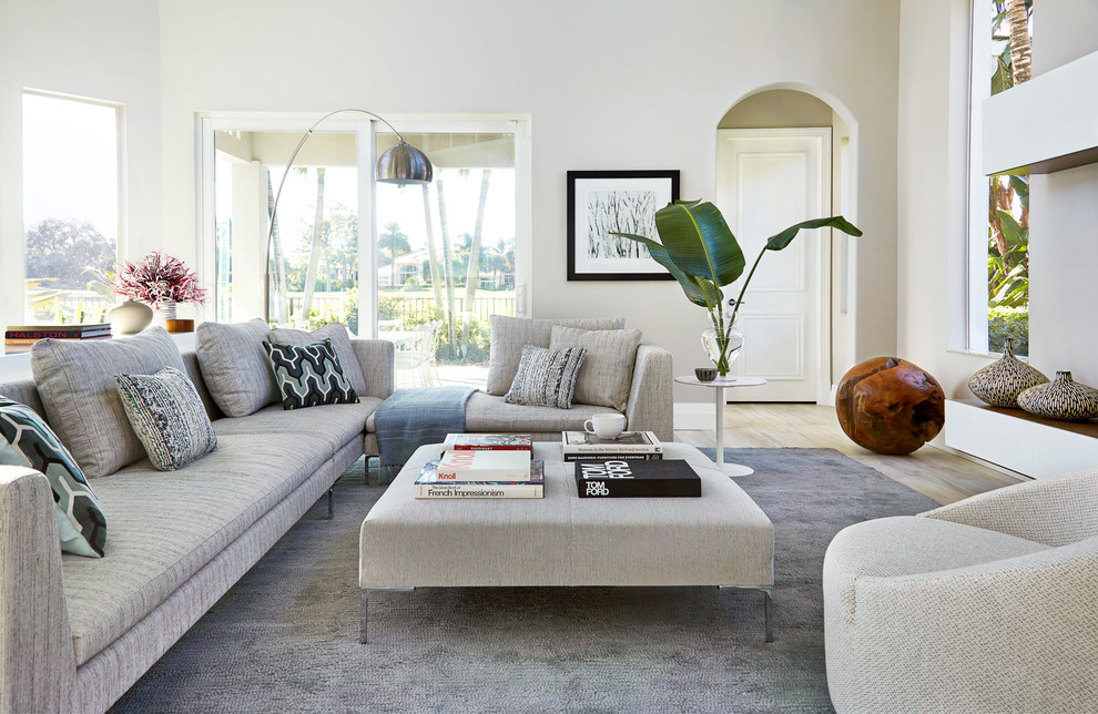 Transitional light wood floor living room photo in Miami with gray walls