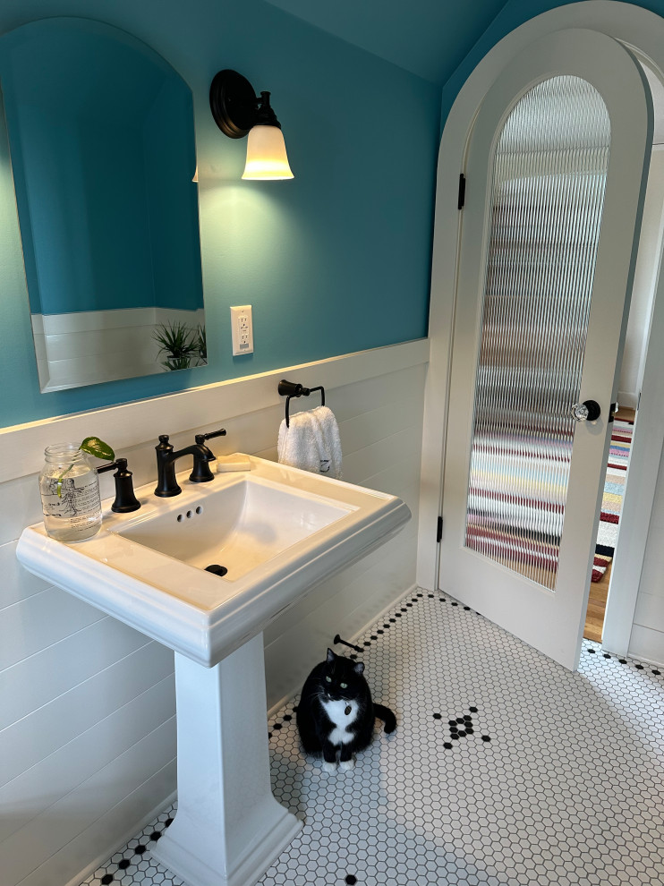 Design ideas for a large classic bathroom in Portland with a claw-foot bath, a shower/bath combination, a two-piece toilet, blue walls, mosaic tile flooring, a pedestal sink, white floors, a shower curtain, a wall niche, a single sink and wainscoting.