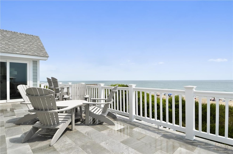 Photo of a mid-sized beach style backyard deck in Other with no cover.
