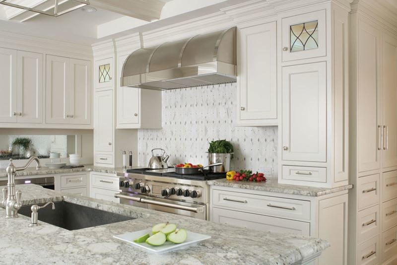 Inspiration for a large transitional l-shaped dark wood floor kitchen pantry remodel in Denver with a drop-in sink, shaker cabinets, white cabinets, laminate countertops, multicolored backsplash, mosaic tile backsplash, stainless steel appliances and an island