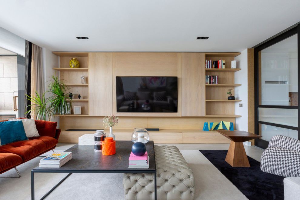 Large contemporary living room in Madrid with a ribbon fireplace, a metal fireplace surround and a wall mounted tv.