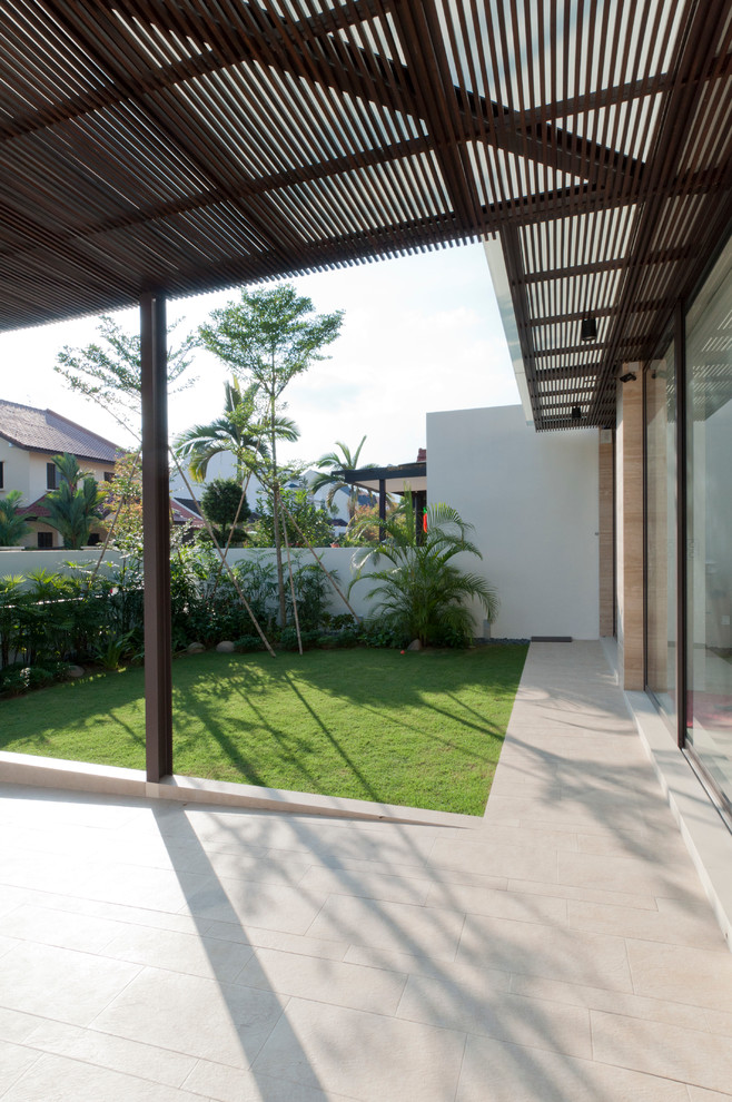 This is an example of a contemporary patio in Singapore.
