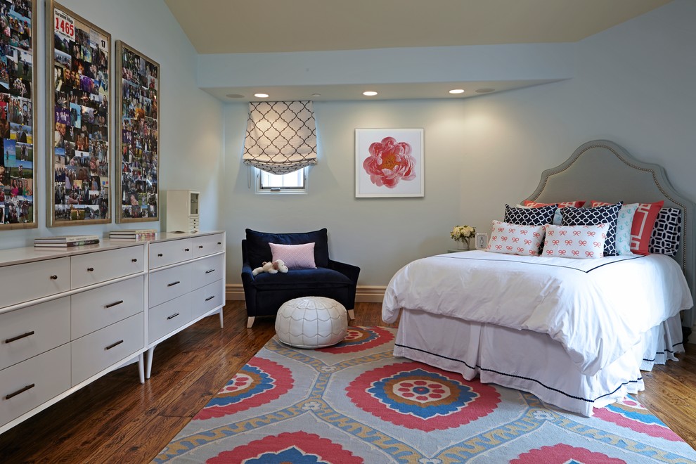 Large transitional kids' room in Los Angeles with grey walls and medium hardwood floors for girls.