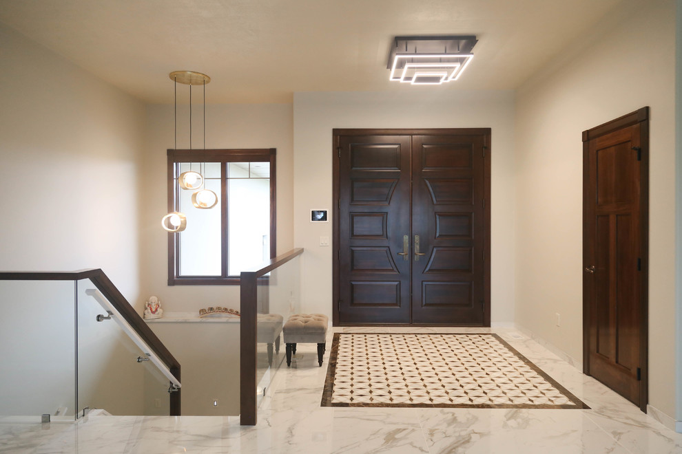 Foyer - mid-sized contemporary porcelain tile and white floor foyer idea with white walls and a medium wood front door