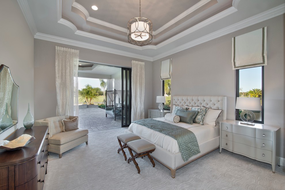 Design ideas for a large mediterranean master bedroom in Miami with beige walls, carpet and no fireplace.