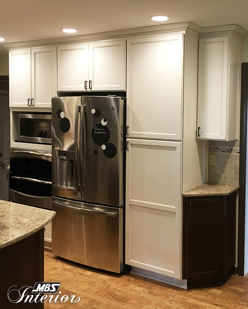 Eat-in kitchen - small transitional u-shaped eat-in kitchen idea with an undermount sink, recessed-panel cabinets, white cabinets, quartzite countertops, multicolored backsplash, mosaic tile backsplash, stainless steel appliances and no island