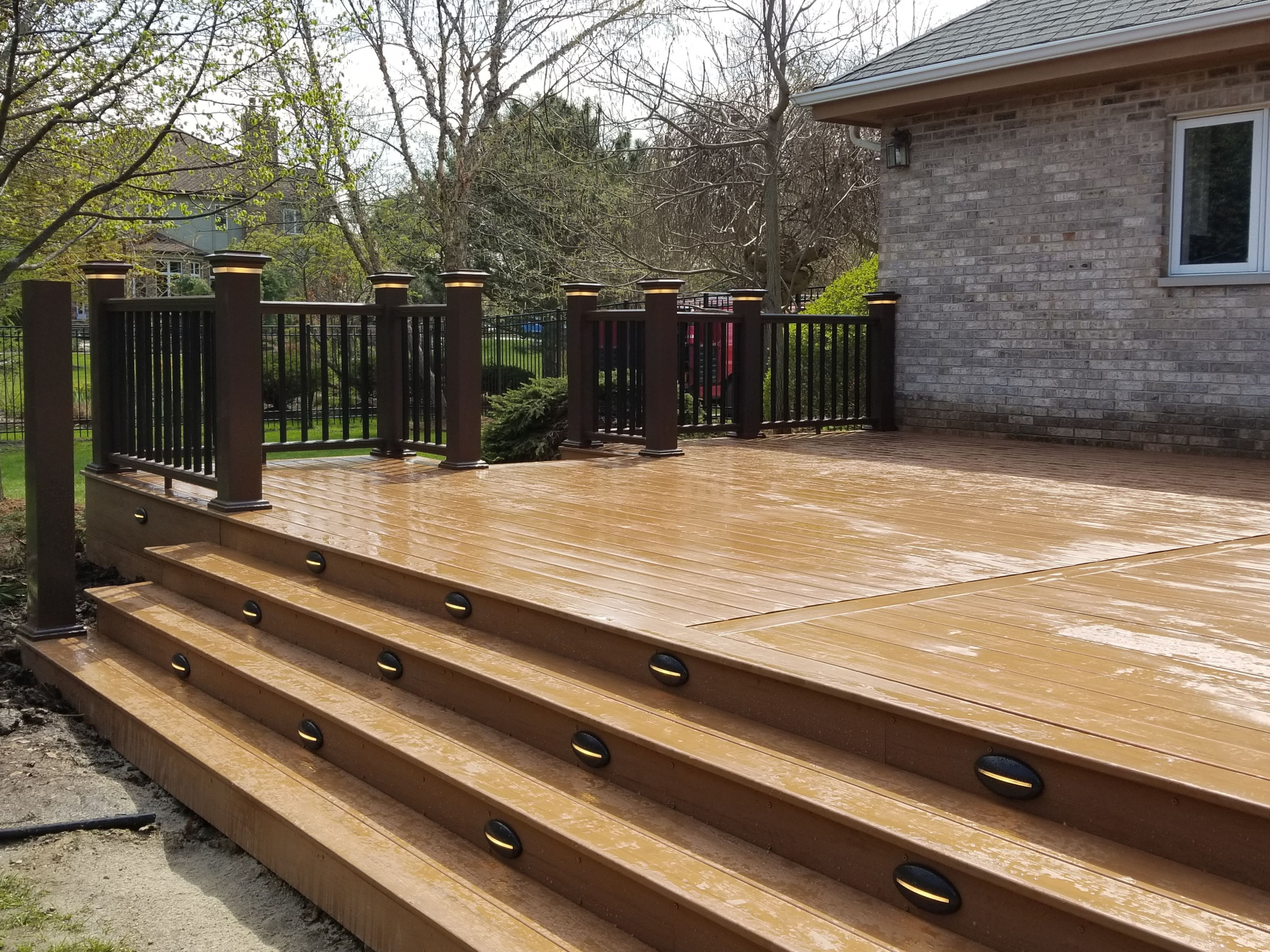 Composite deck with composite railing and lighting