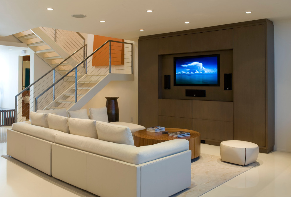 Photo of a mid-sized contemporary open concept living room in New York with white walls, a built-in media wall, no fireplace and beige floor.