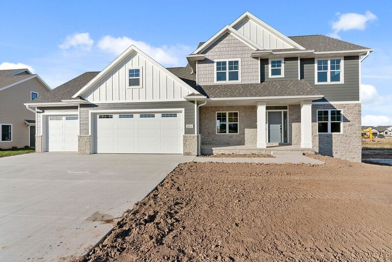 Inspiration for a mid-sized transitional gray two-story mixed siding gable roof remodel with a shingle roof