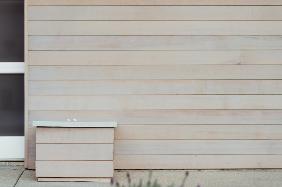 Example of a mid-sized 1960s gray one-story wood exterior home design in Orange County