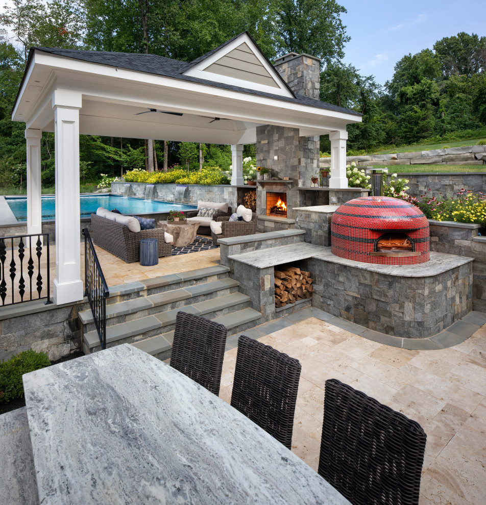 Design ideas for a mid-sized contemporary backyard patio in DC Metro with an outdoor kitchen, natural stone pavers and a pergola.