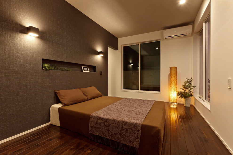 Contemporary master bedroom in Other with grey walls, dark hardwood floors and brown floor.