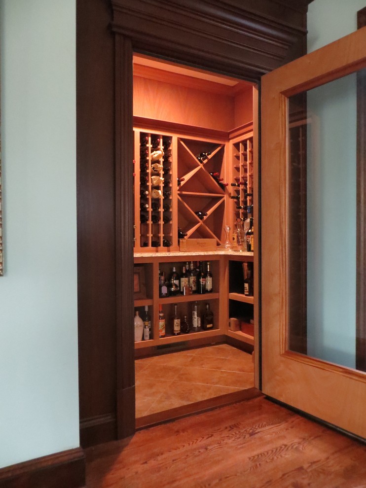 Mid-sized traditional wine cellar in Philadelphia with light hardwood floors and diamond bins.