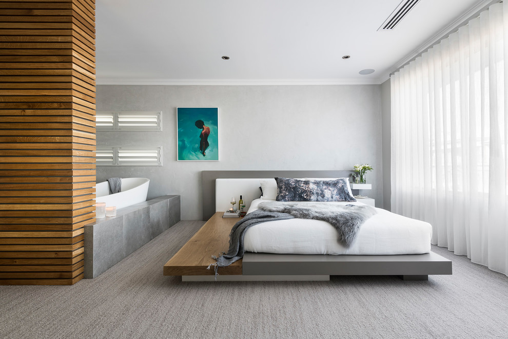 This is an example of a contemporary master bedroom in Perth with grey walls, carpet and grey floor.