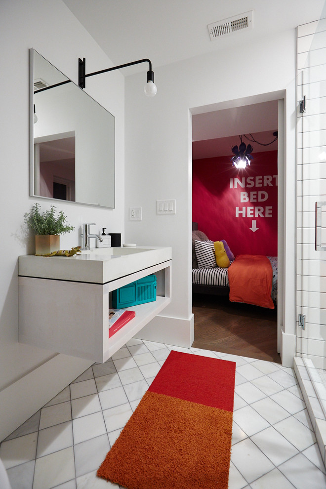 Inspiration for a mid-sized eclectic 3/4 bathroom in Chicago with open cabinets, white cabinets, an alcove shower, a two-piece toilet, white tile, ceramic tile, white walls, ceramic floors, an integrated sink and concrete benchtops.