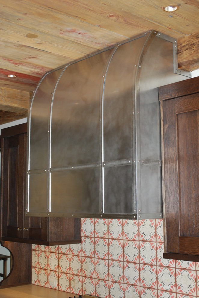 Mid-sized mountain style kitchen photo in Denver with shaker cabinets, dark wood cabinets and stainless steel appliances