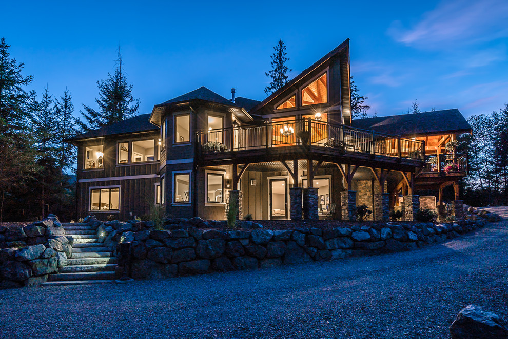 Inspiration for a mid-sized rustic two-story beige home design remodel