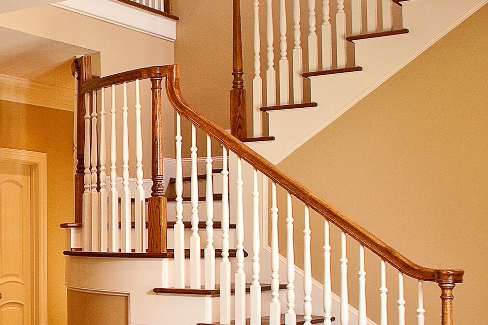 Design ideas for a large traditional wood u-shaped staircase in Houston with wood risers.
