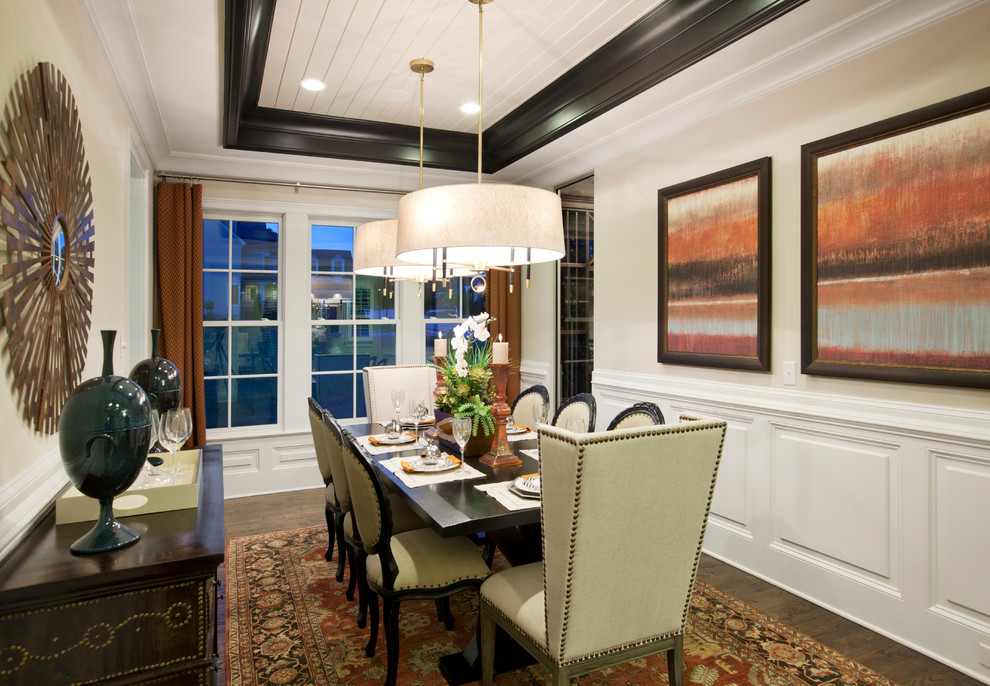 Inspiration for a mid-sized transitional separate dining room in Raleigh with white walls and dark hardwood floors.