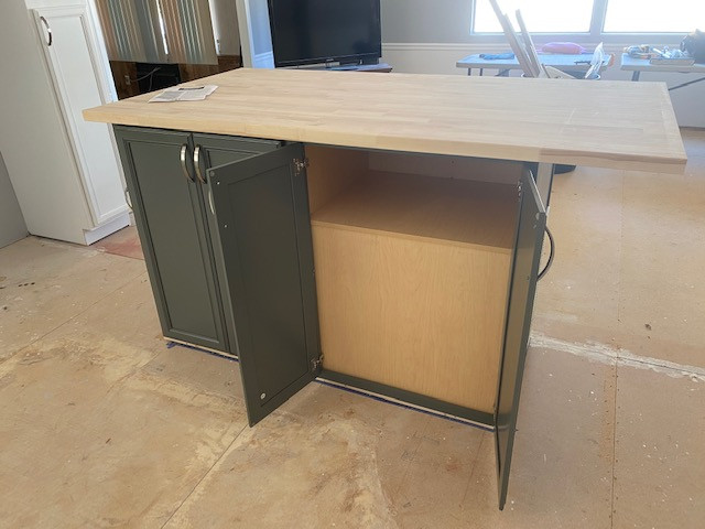 Inspiration for a mid-sized l-shaped eat-in kitchen remodel with a double-bowl sink, flat-panel cabinets, white cabinets, laminate countertops, an island and gray countertops