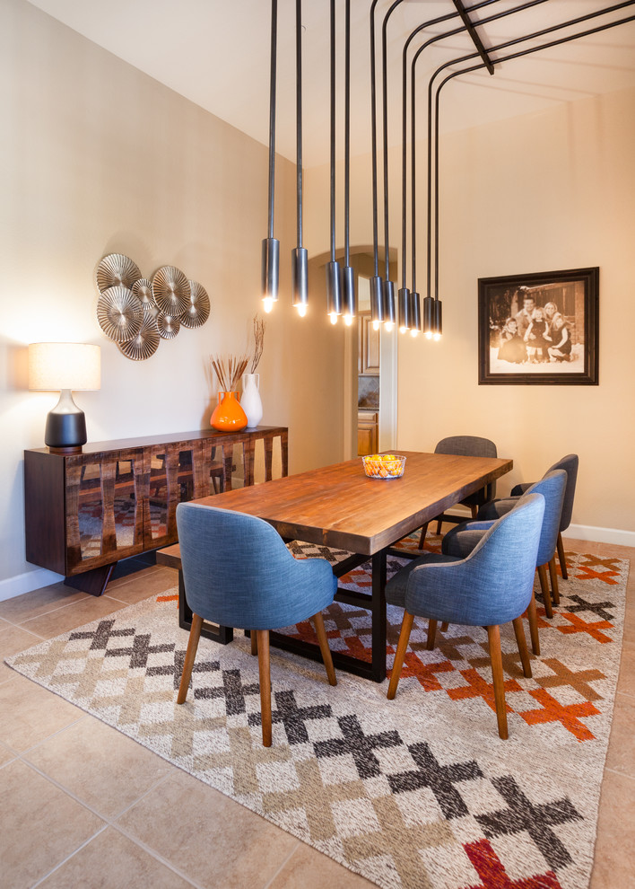 Large modern open plan dining in Phoenix with beige walls and porcelain floors.