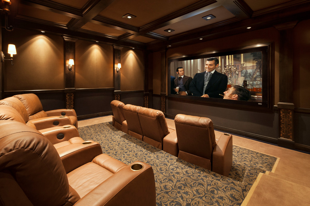 Inspiration for a traditional home theatre in Santa Barbara with brown walls and carpet.