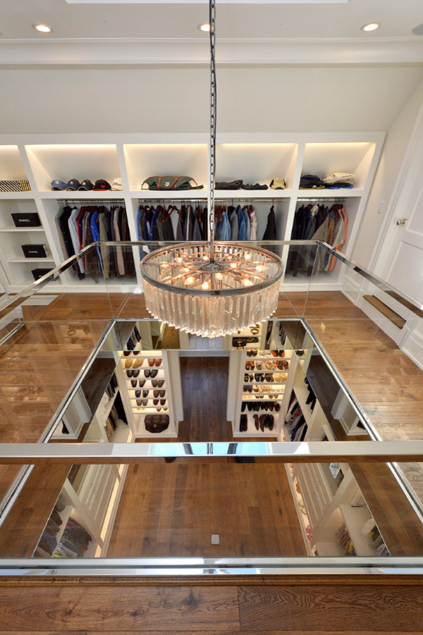 Design ideas for an expansive transitional storage and wardrobe in New York.