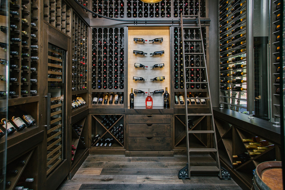 Inspiration for a mid-sized transitional dark wood floor wine cellar remodel in Portland