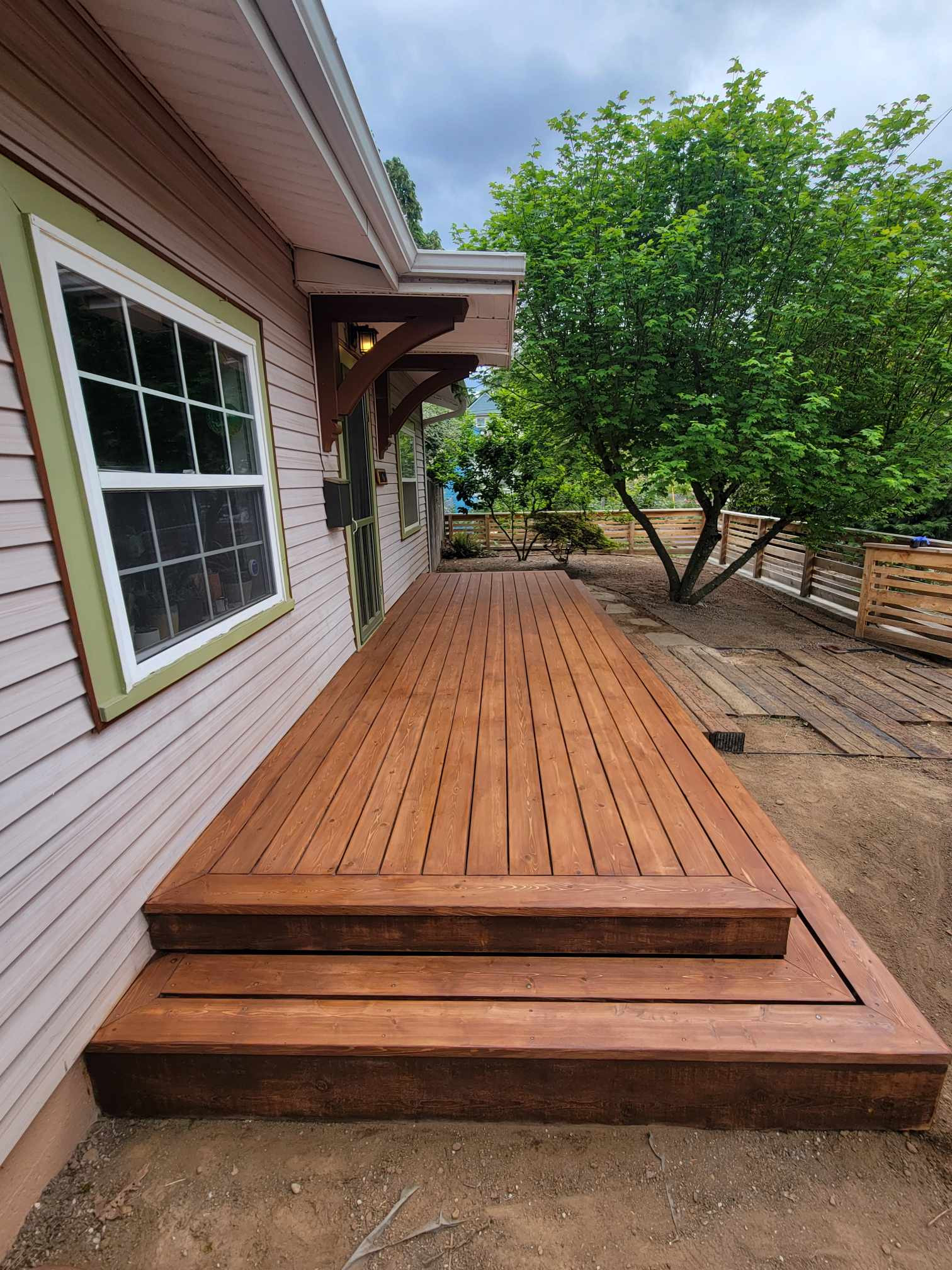 Tight knot cedar deck with rusticana stain