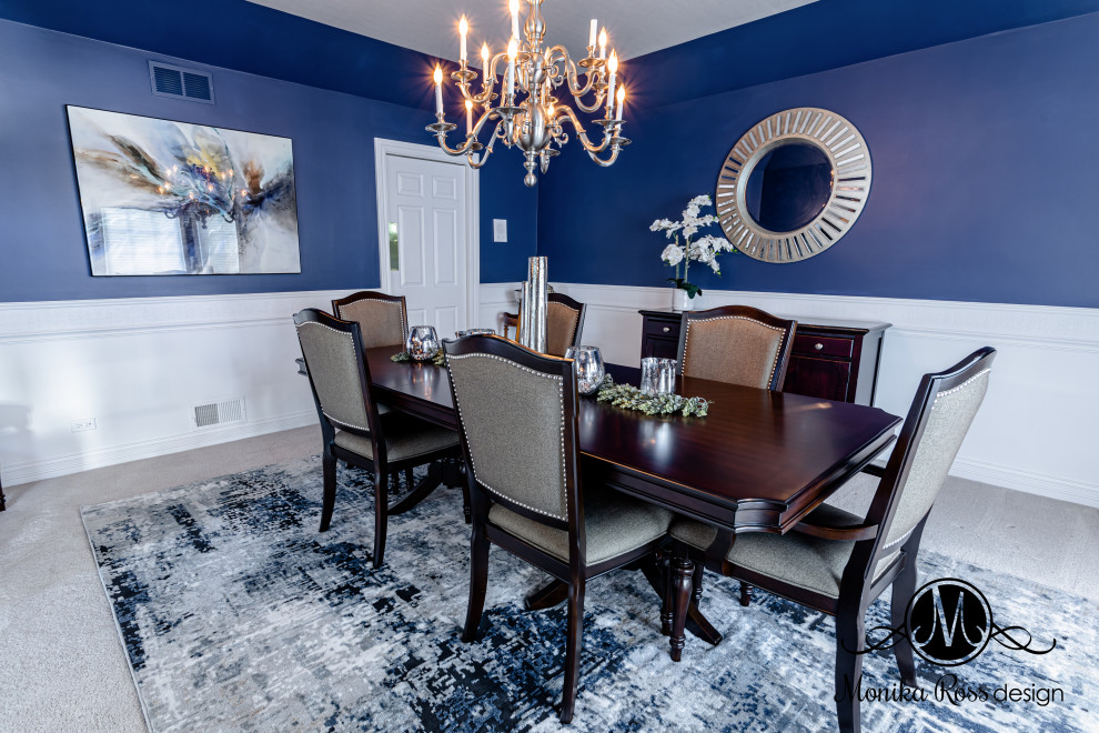 This is an example of a large transitional separate dining room in Chicago with blue walls, carpet, beige floor, wallpaper and decorative wall panelling.