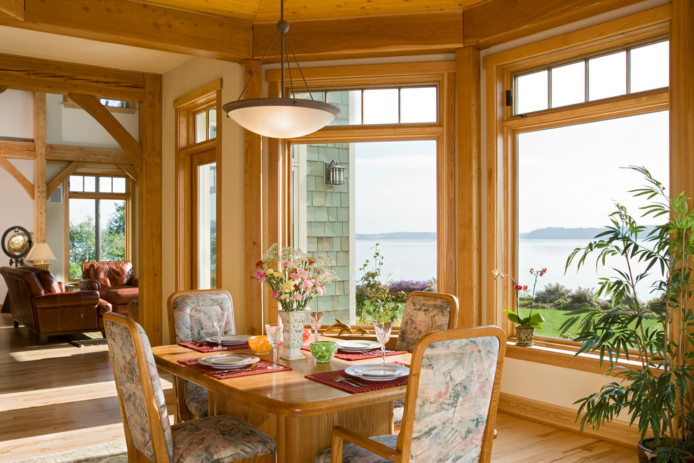 Inspiration for a large beach style open plan dining in Seattle with beige walls, medium hardwood floors and no fireplace.