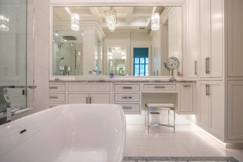Inspiration for a transitional master white tile and porcelain tile porcelain tile, white floor, double-sink and coffered ceiling freestanding bathtub remodel with beaded inset cabinets, white cabinets, a two-piece toilet, white walls, a vessel sink, quartzite countertops, a hinged shower door, gray countertops and a floating vanity