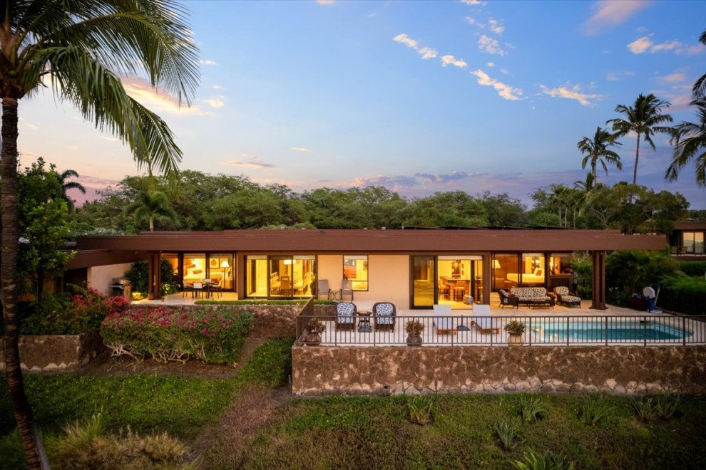 Example of a large island style exterior home design in Hawaii