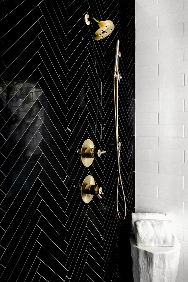 Example of a transitional master black and white tile and marble tile bathroom design