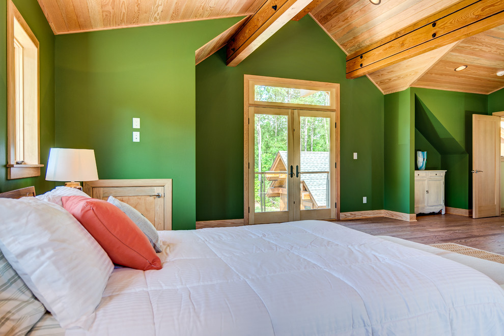 Bedroom - large modern guest medium tone wood floor bedroom idea with green walls and no fireplace