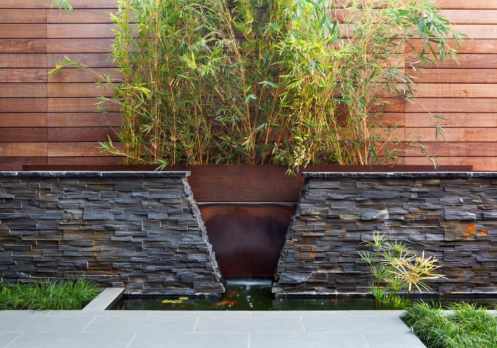 Large asian backyard formal garden in San Francisco with a water feature.