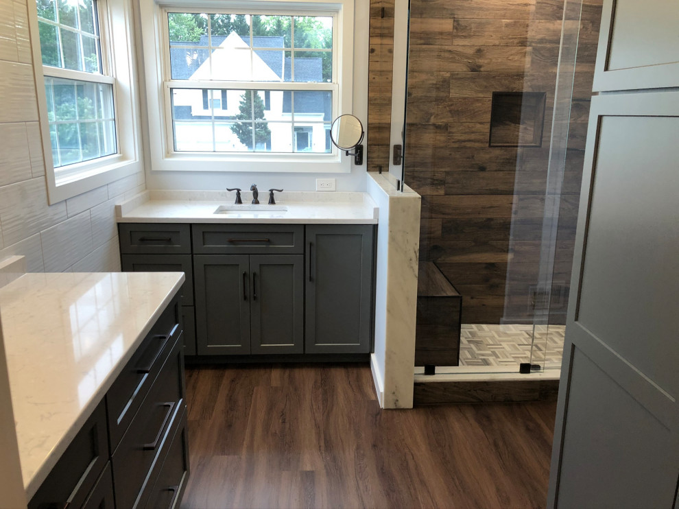 Example of a large mountain style master white tile and ceramic tile wood-look tile floor, brown floor and double-sink bathroom design in DC Metro with flat-panel cabinets, gray cabinets, an integrated sink, granite countertops, white countertops, a niche and a built-in vanity