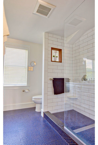 Design ideas for a small contemporary master bathroom in Boston with raised-panel cabinets, white cabinets, an alcove shower, a two-piece toilet, white tile, ceramic tile, yellow walls, ceramic floors, engineered quartz benchtops, blue floor and an open shower.