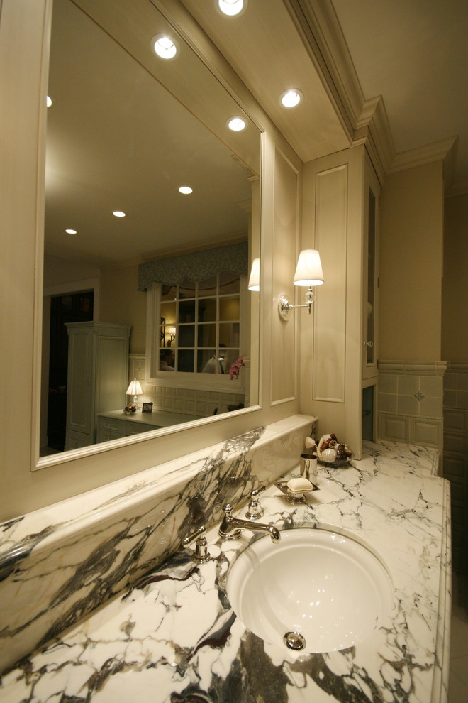 Bathroom - large transitional master gray tile bathroom idea in Chicago with recessed-panel cabinets, distressed cabinets, marble countertops, an undermount sink and beige walls