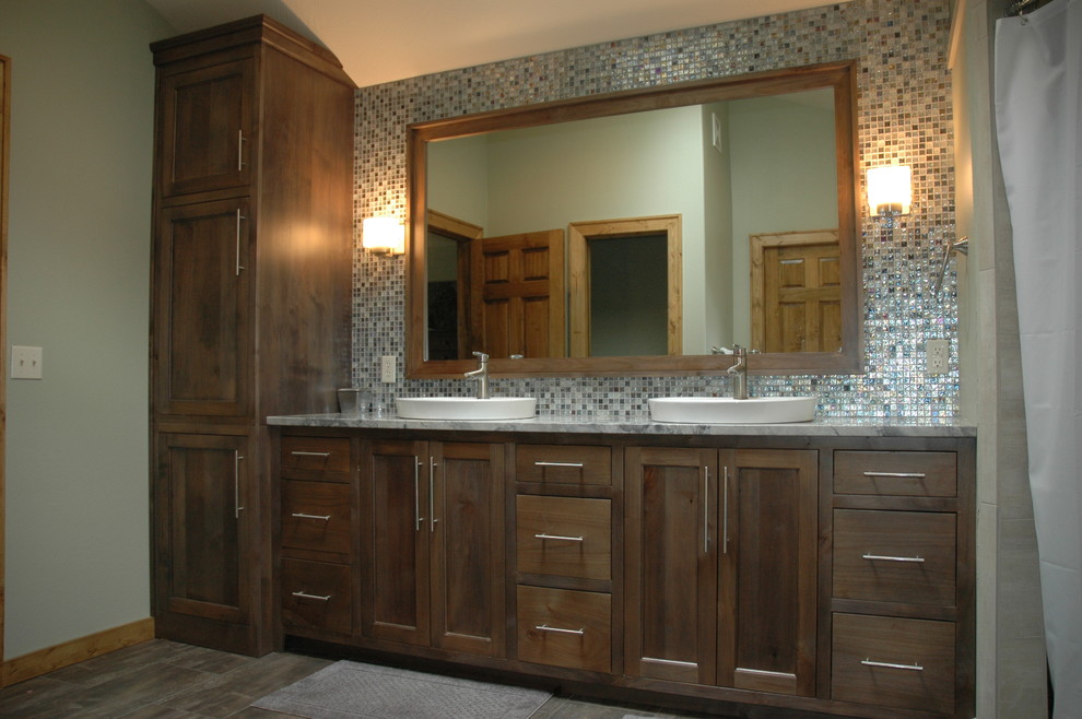 Inspiration for a mid-sized transitional master multicolored tile medium tone wood floor corner shower remodel with a vessel sink, flat-panel cabinets, dark wood cabinets, marble countertops, a two-piece toilet and green walls