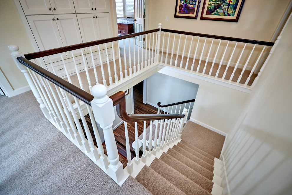 This is an example of a mid-sized staircase in San Diego with planked wall panelling.