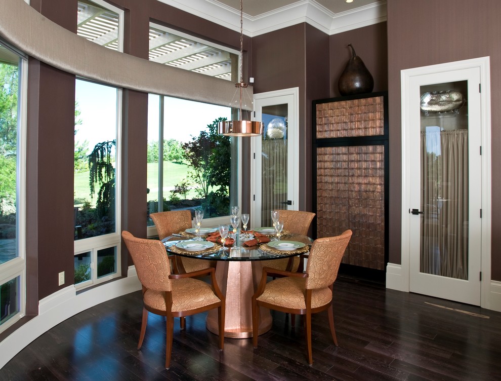 This is an example of a mid-sized contemporary open plan dining in Sacramento with brown walls and dark hardwood floors.